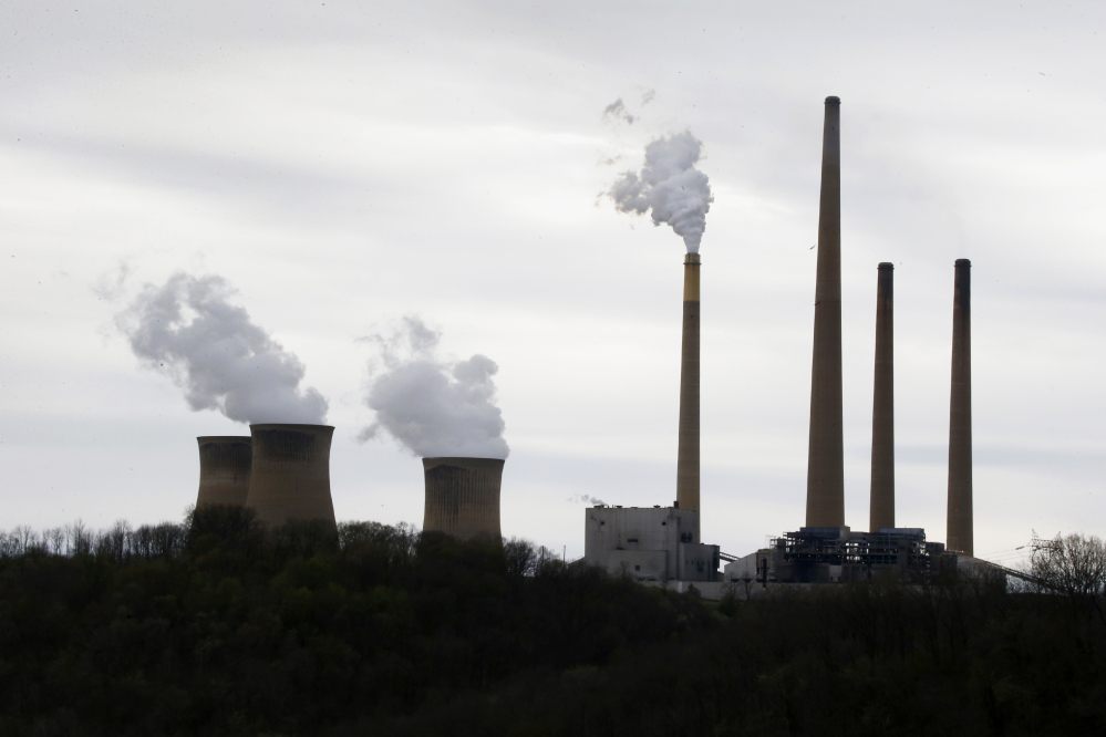 This photo taken May 5, 2014 shows the stacks of the Homer City Generating Station in Homer City, Pa. Three years ago, the operators of one of the nationÃ­s dirtiest coal-fired power plants warned of Ã¬immediate and devastatingÃ® consequences from the Obama administrationÃ­s push to clean up pollution from coal. The Associated Press