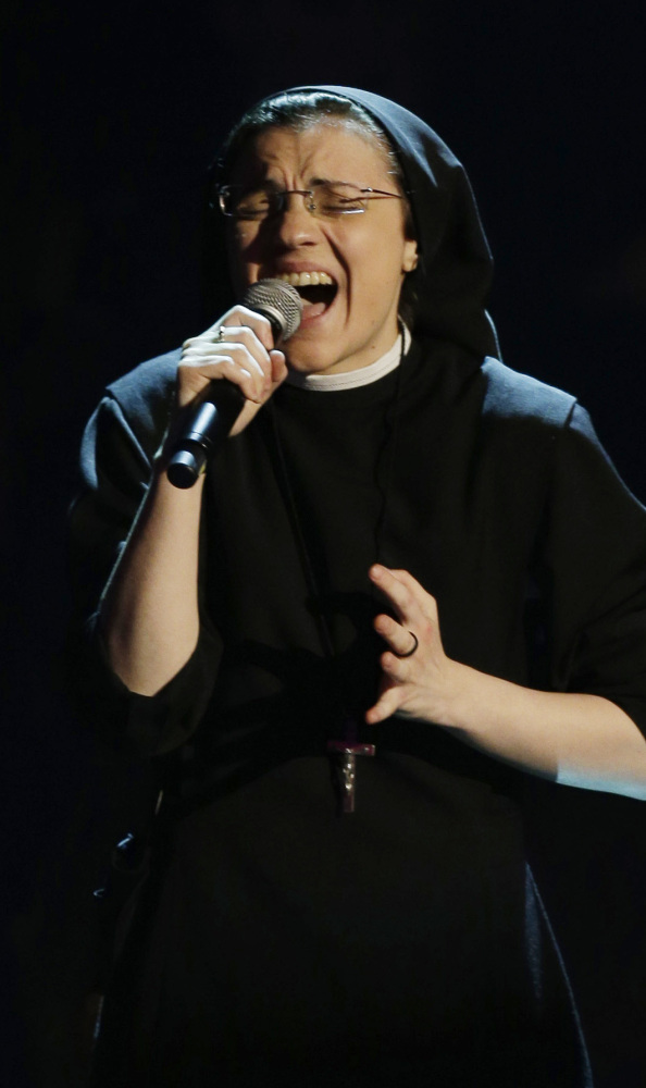 The Associated Press Sister Cristina Scuccia performs during the Italian version of “The Voice” TV talent show in Milan, Italy.