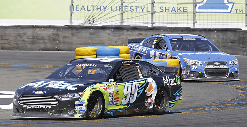 Carl Edwards (99) leads Jeff Gordon in the final laps during the NASCAR Sprint Cup Series auto race Sunday, June 22, 2014, in Sonoma, Calif. Edwards won the race and Gordon finished second. The Associated Press