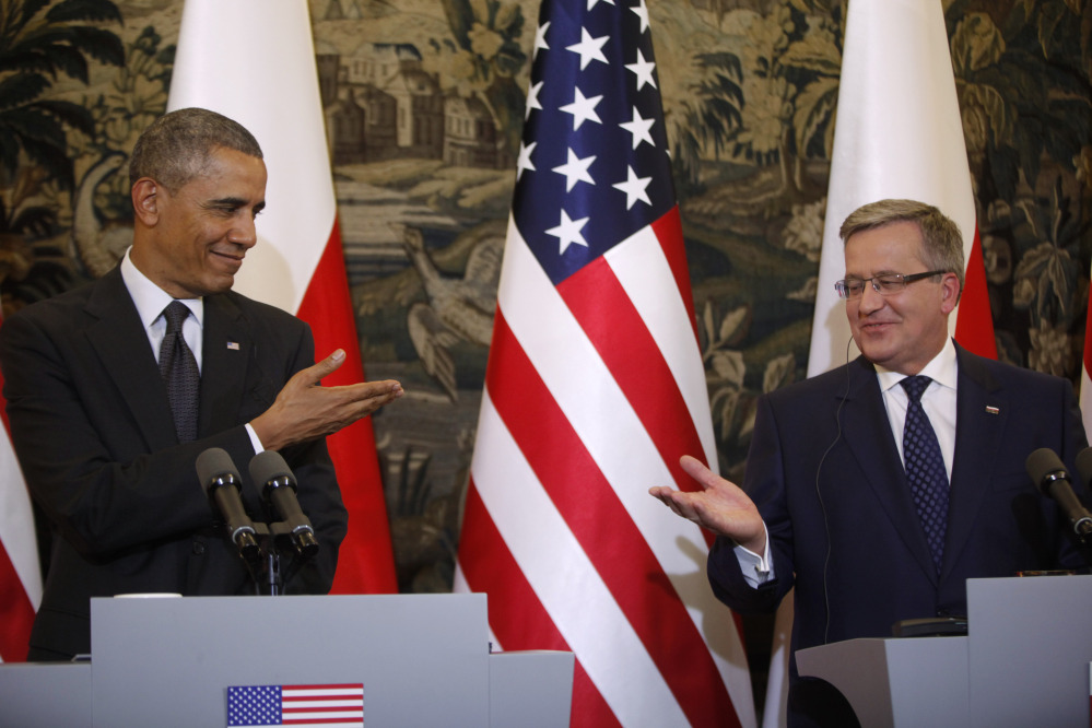 The Associated Press As President Obama called Tuesday for a heavier U.S. military presence in Europe, Poland President Bronislaw Komorowski, right, said his country intends to increase its defense budget.