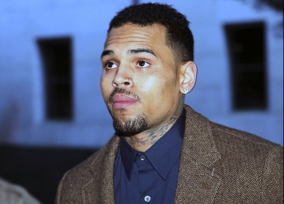FILE - In this Feb. 3, 2014, file photo, R&B singer Chris Brown arrives at Los Angeles Superior Court for a probation review hearing in Los Angeles. Brown was released early Monday, June 2, 2014, from a Los Angeles County jail, authorities said. Brown had been in custody since mid-March, when he was arrested after being expelled from a court-ordered rehab sentence for violating its rules. The Associated Press