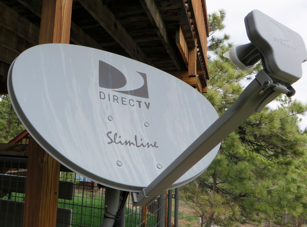 A DirecTV satellite dish is seen on a home outside Golden, Colo., in May. Reuters