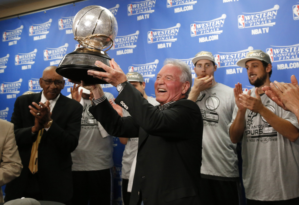 Spurs owner Peter Holt holds up the Western Conference trophy following Game 6 of the Western Conference finals Saturday night. The Spurs and Heat meet for the NBA championship for the second straight year. Miami won last year in seven games. The Associated Press