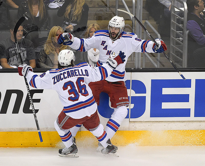 New York Rangers left wing Benoit Pouliot, right, celebrates his goal with right wing Mats Zuccarello, of Sweden, against the Los Angeles Kings during the first period in Game 1 of the NHL hockey Stanley Cup Finals, Wednesday
The Associated Press