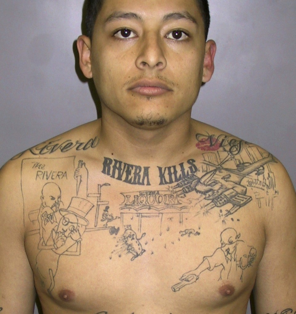 The Associated Press This undated photo provided by the Los Angeles Sheriff’s Department shows convicted murderer Anthony Garcia, sentenced to 65 years in prison in 2011 after a homicide investigator discovered he had the scene of an unsolved 2004 murder inked on his chest.