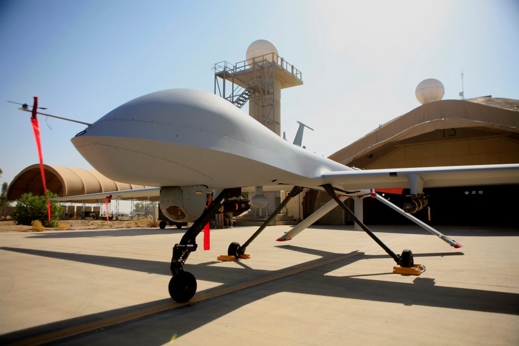 An MQ-4 Predator sits on the tarmac at Balad Air Base, north of Baghdad, Iraq, in this 2007 photo.  A Pentagon official says drones have started overflights to bolster manned and unmanned reconnaissance flights.

The Associated Press