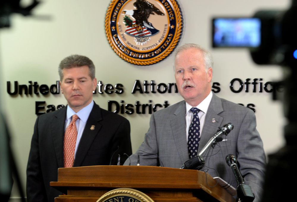 2014 Associated Press File Photo U.S. Attorney John M. Bales, right, and Brian Moskowitz with Homeland Security address media in January after several raids in Port Arthur and Houston that allegedly involved a large operation of illegal employment in multiple states. Two of those arrested pleaded guilty Wednesday.