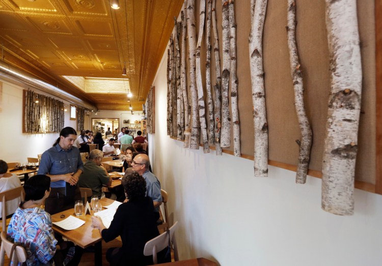 Birch-branch wall decorations seem to underscore Vinland's commitment to natural Maine ingredients in its fare.