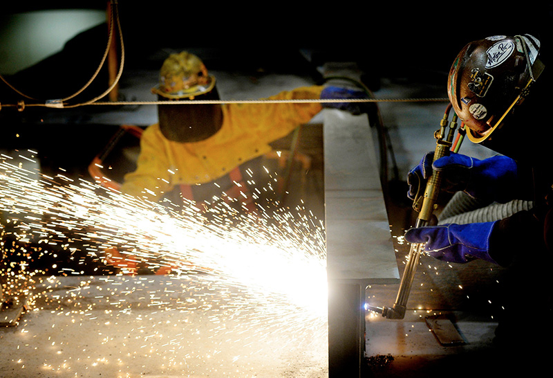 Welders work on a beam on the top section of the stern of the second Zumwalt-class destroyer at Bath Iron Works on May 1, 2014.
Shawn Patrick Ouellette/Staff Photographer