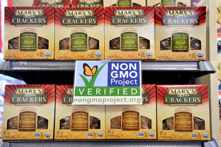 In this file photo from July 2013, Whole Foods marked their shelves with labels promoting non-GMO products.