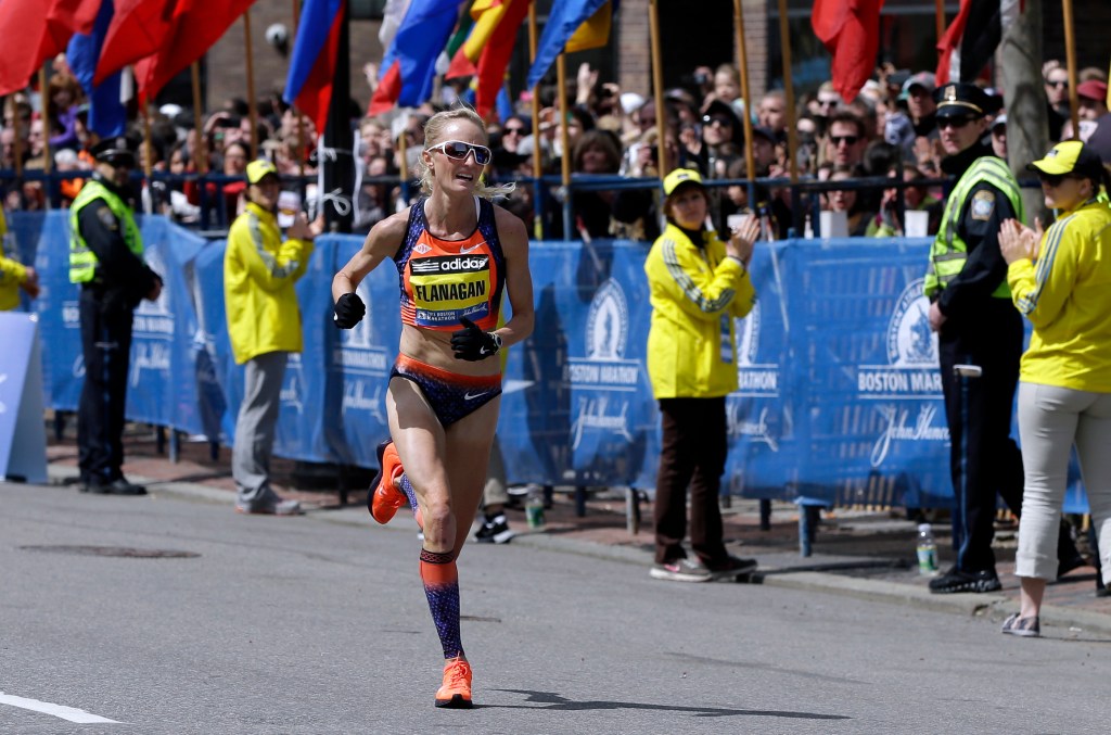 Shalane Flanagan approaches the finish line to finish fourth in the women's division of the 2013 Boston Marathon. The Associated Press