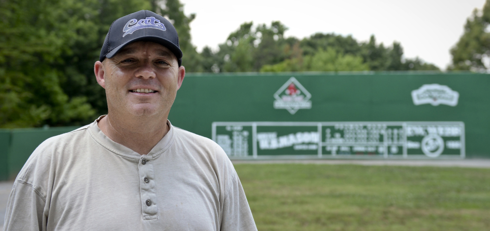 David Spainhour stands in his backyard in King, N.C., which he fashioned into a mini Fenway Park.