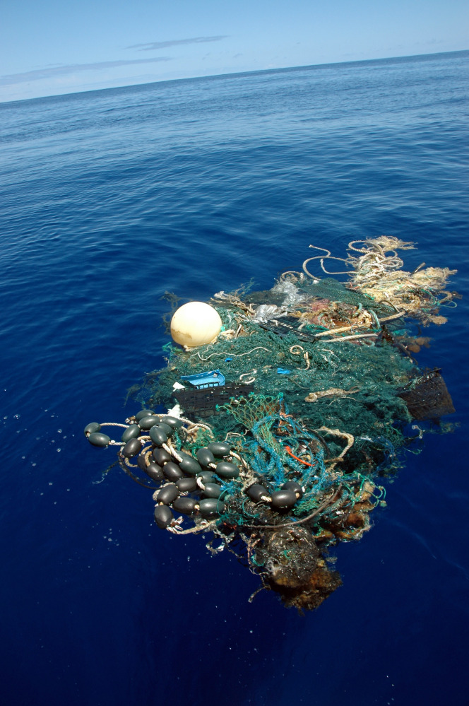 A patch of sea garbage, some of it plastic, floats in the Pacific Ocean in 2009. The research ship that recently circled the globe to measure the extent of such debris did not look at plastic sitting beneath the surface or on the ocean floor.