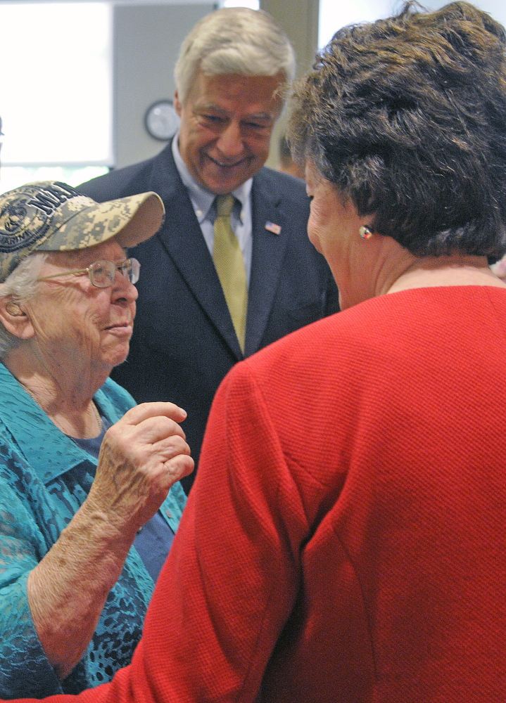 Marine Corps veteran Ruby Gilmore, 83, greets U.S. Rep. Mike Michaud and U.S. Sen. Susan Collins on Monday at the women’s clinic during the grand opening.