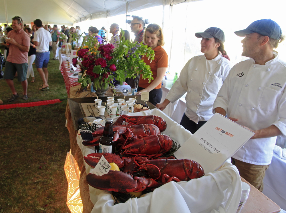 Chef Steve Corry and pastry chef Addie Davis, both of the 555 restaurant, wait for visitors to try their truffled lobster “mac & cheese” at the Taste of the Nation event held Sunday at Fort Williams Park in Cape Elizabeth. The nature of lobster meat makes it easy to create innovative dishes, Corry says.