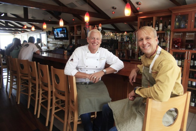 Mark Gaier, left, and Clark Frasier inside their MC Perkins Cove. They opened M.C. Spiedo in the Renaissance Boston Waterfront Hotel in February.