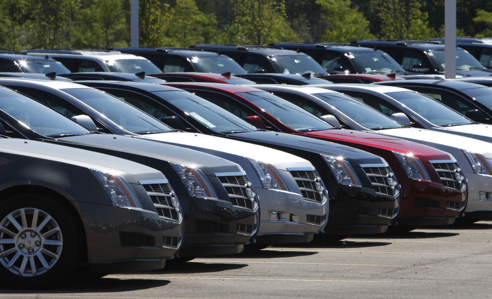 Cadillac CTS models, which are covered in one of GM’s latest recalls, are displayed outside a Michigan dealership.