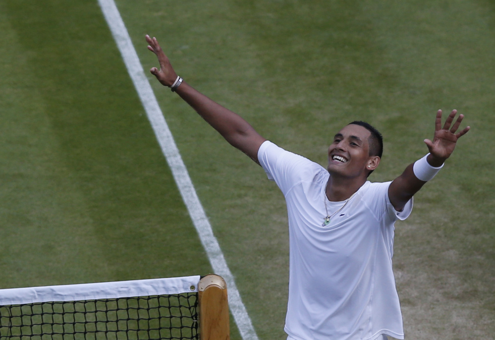 Nick Kyrgios of Australia celebrates defeating Rafael Nadal of Spain in their men’s singles match on Centre Court.