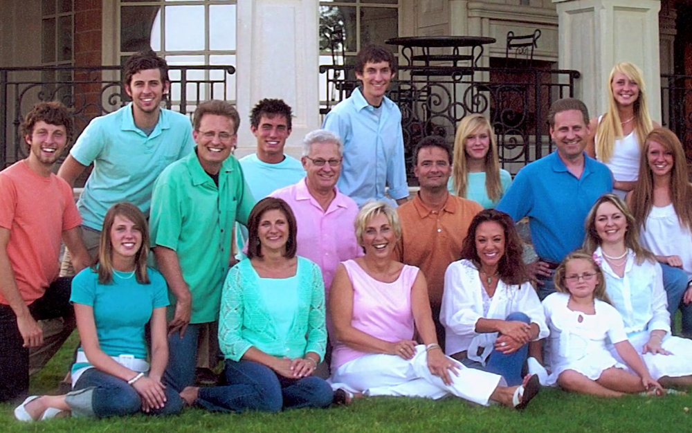 Members of the Green family that run Oklahoma-based Hobby Lobby pose outside the home of David , middle row third from left, and Barbara, front row, third from left, in 2006. Mart Green, who rescued Oral Roberts University, is just left of his father; Steve Green is in the same row at the far right. The Supreme Court ruled 5-4 Monday that requiring closely-held companies to pay for some methods of contraception violates religious freedom.