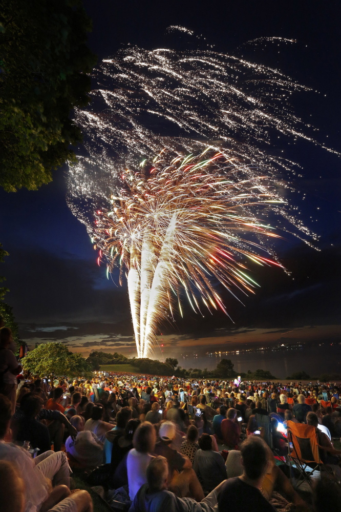 Crowds watch the fireworks display during the Stars and Stripes Spectacular 4th of July celebration on July 4, 2013 over the Eastern Promenade in Portland.