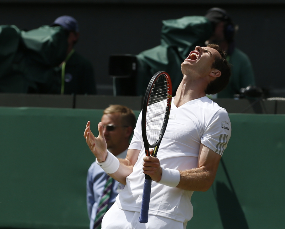 Andy Murray of Britain reacts Wednesday after missing a point against Grigor Dimitrov of Bulgaria during their men’s singles quarterfinal at Wimbledon. Murray, the defending champion, was beaten in straight sets, 6-1, 7-6 (4), 6-2.