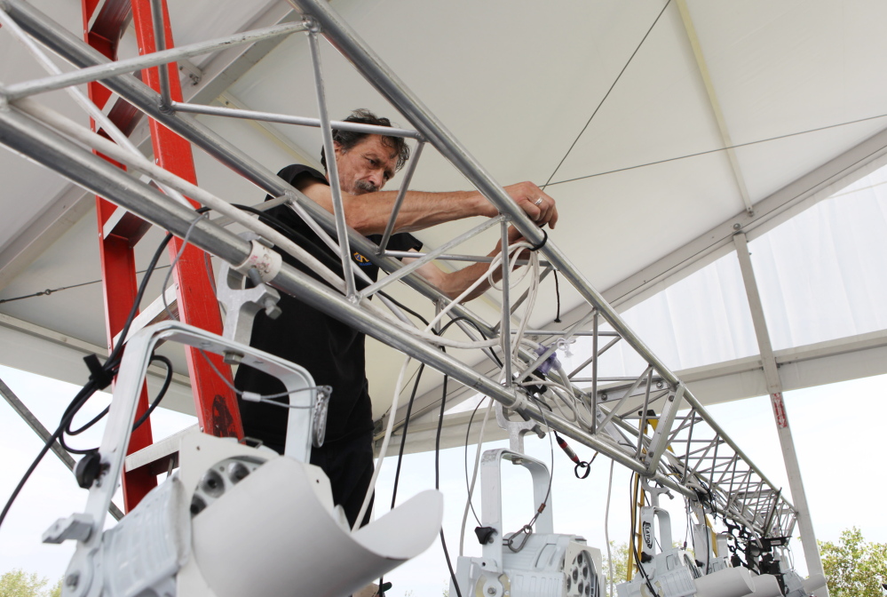 Bill Brown works Thursday on wiring the stage lights for Portland’s Fourth of July celebration, now scheduled for Saturday. The Portland Symphony Orchestra’s “Patriotic Pops” performance begins at 7:40 p.m. and the fireworks at 9:20 p.m.
