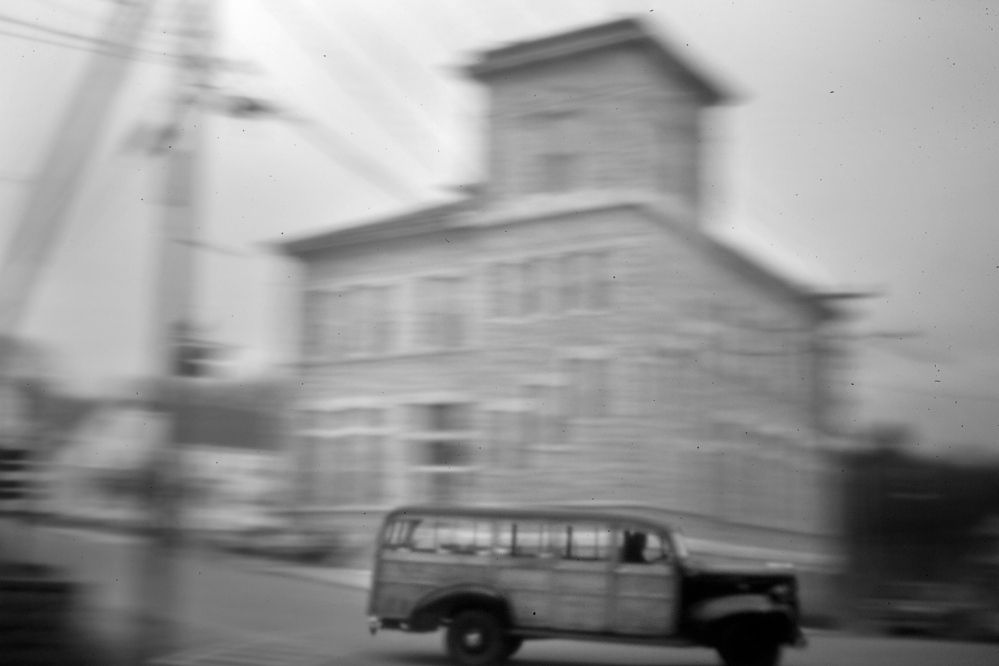 An antique truck steers past the Custom House in Eastport early on April 30. Some leaders and residents of the nation’s easternmost city – and elsewhere in Maine – took steps to retaliate against a young attorney when he began to represent the Indians in the mid-1960s.