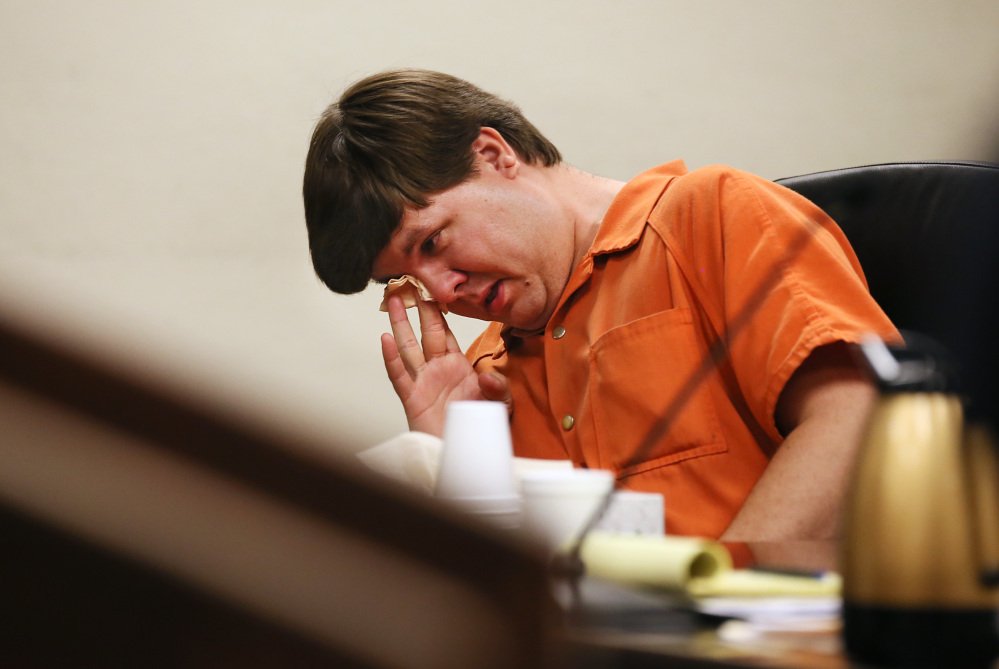 Justin Ross Harris, the father of a toddler who died after police say he was left in a hot car for about seven hours, wipes his eye as he sits during his bond hearing in Cobb County Magistrate Court on Thursday in Marietta, Ga.