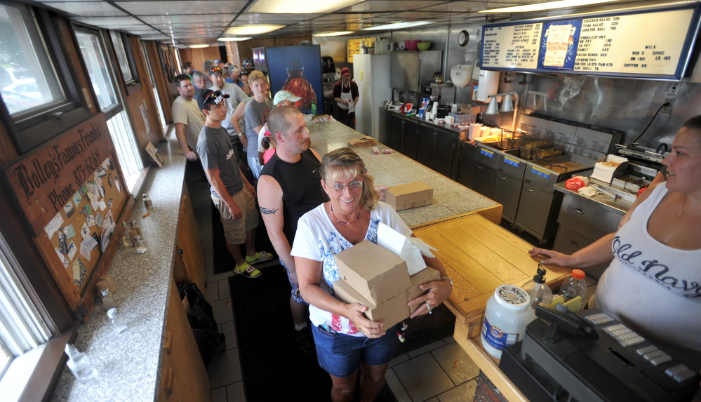 A line stretches out the door Thursday at Bolley’s Famous Franks on College Avenue in Waterville. The landmark lunch destination served its last hot dog on Thursday, ending a 52-year run.