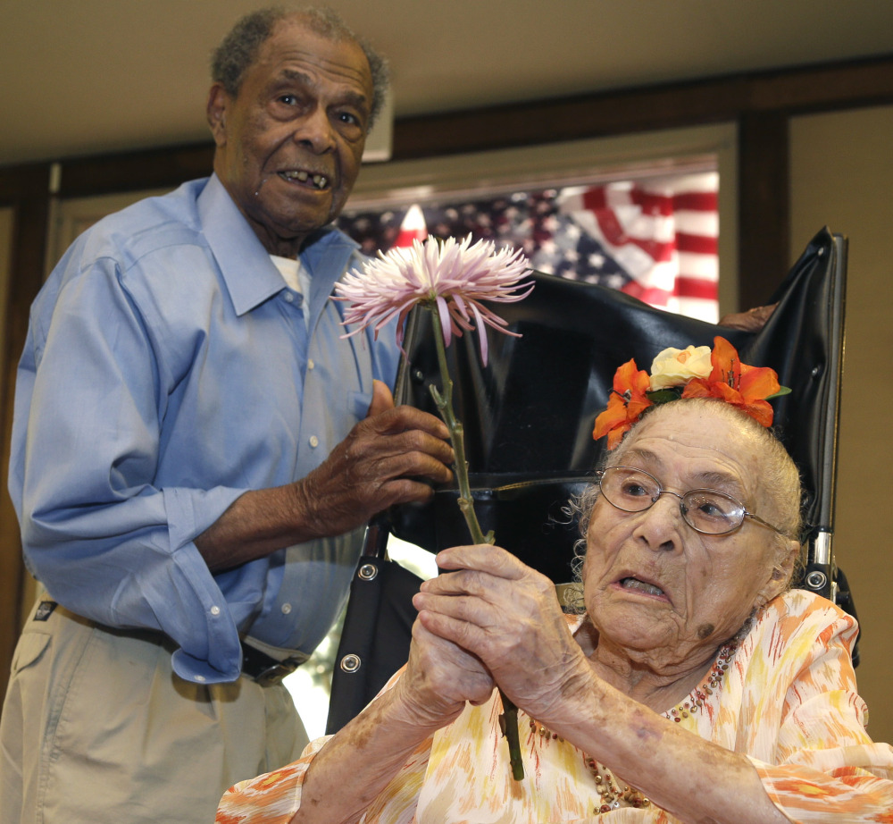 Gertrude Weaver, 116, talks with her son Joe Weaver, 93, on Thursday at Silver Oaks Health and Rehabilitation Center in Camden, Arkansas.