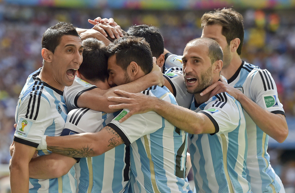 Argentina players celebrate after Gonzalo Higuain scored against Belgium in the World Cup quarterfinals Saturday at the Estadio Nacional in Brasilia, Brazil. Argentina won, 1-0.