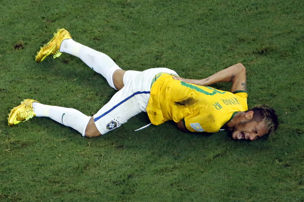 Brazil’s Neymar grimaces in pain during the World Cup quarterfinal soccer match between Brazil and Colombia at the Arena Castelao in Fortaleza, Brazil, Friday.