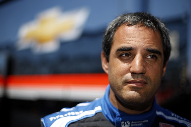 IndyCar driver Juan Pablo Montoya, of Colombia, listens to a reporter’s question during an interview after a practice session for Sunday’s Pocono IndyCar 500 auto race, Saturday.