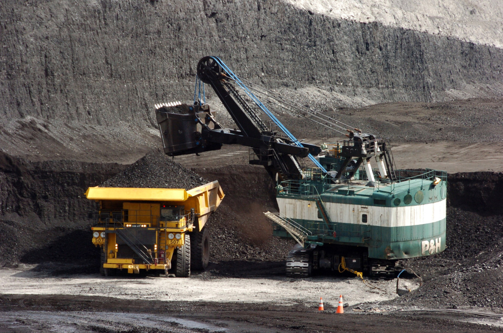 A mechanized shovel loads coal onto a haul truck at the Cloud Peak Energy’s Spring Creek mine near Decker, Mont. Coal industry representatives say lawsuits against mines in the West could have consequences across the U.S. as environmentalists seek changes in how mining is approved on federally-owned reserves.