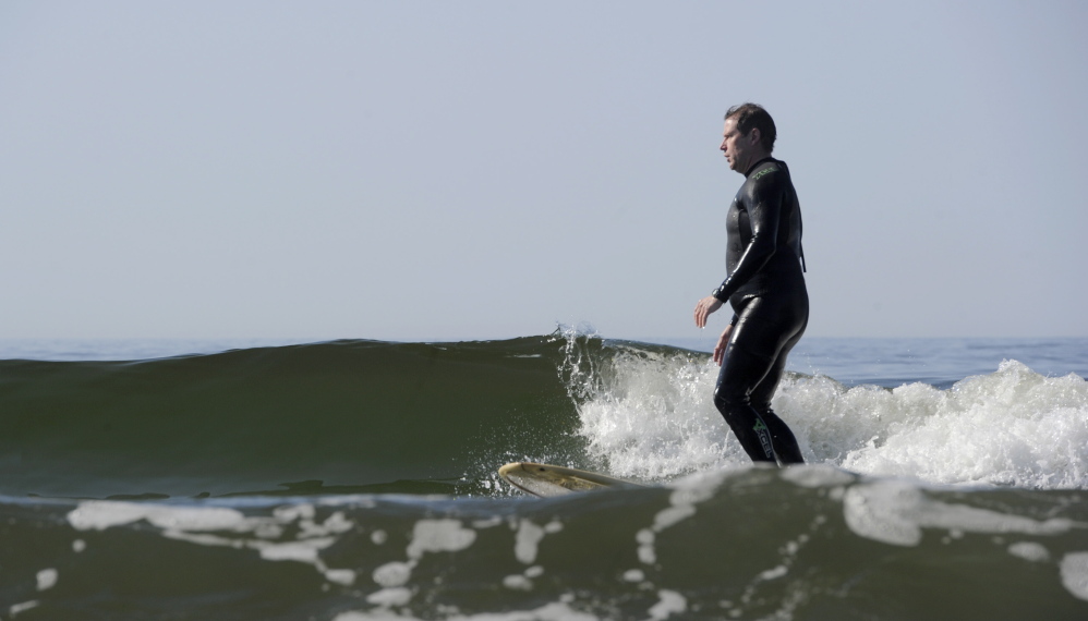 Justice John O’Neil Jr. surfs at Kennebunk Beach. Logan Werlinger/Staff Photographer
