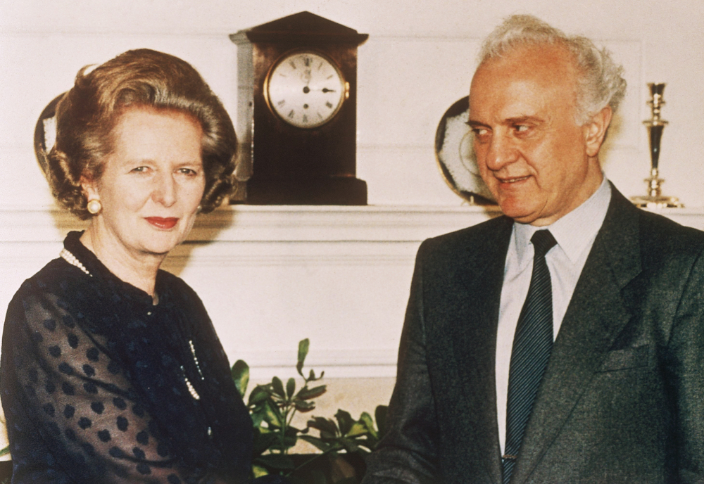 British Prime Minister Margaret Thatcher welcomes Soviet Foreign Minister Eduard Shevardnadze on his arrival at her 10 Downing Street residence in London in this July 1986 photo.