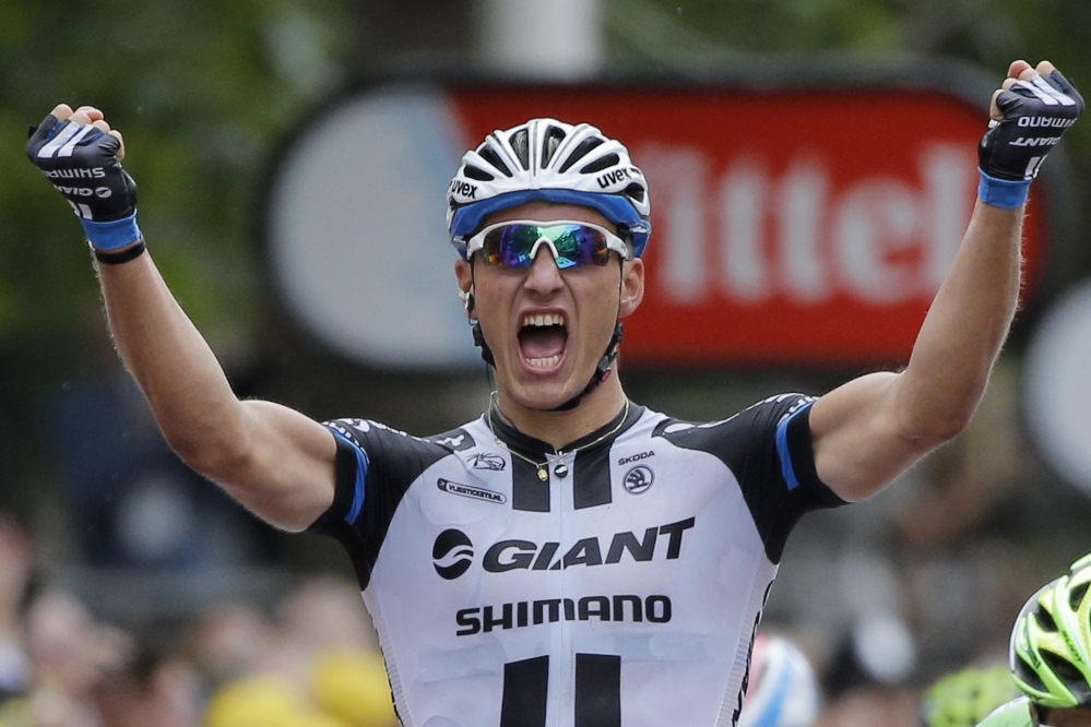 Germany’s sprinter Marcel Kittel celebrates as he crosses the finish line to win the third stage of the Tour de France cycling race in England on Monday.