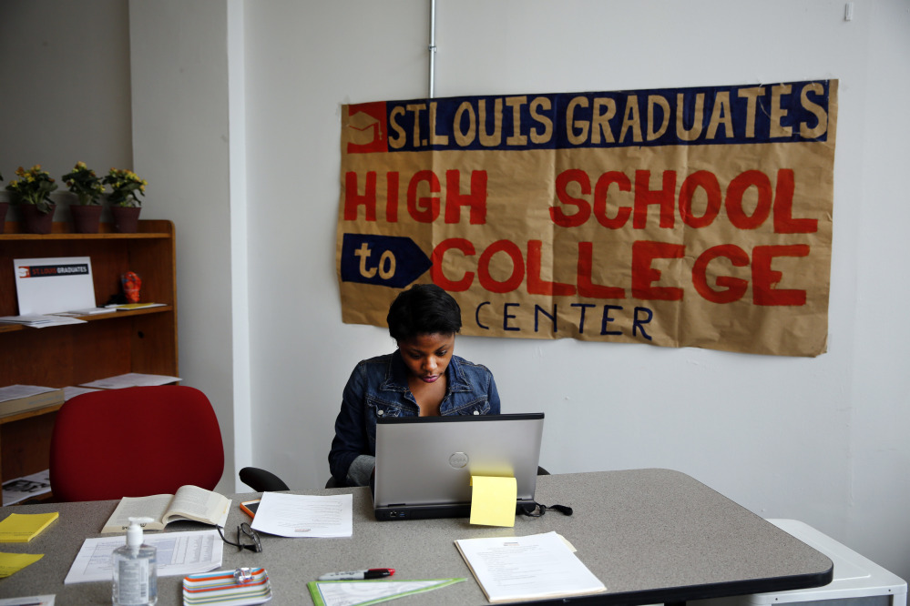 Intern Daisha Tanking working at the St. Louis High School to College Center in St. Louis. A drop-in counseling center akin to a pop-up retail store, the center helps low-income students make the transition to college by negotiating financial aid agreements, housing contracts and the other myriad details of college enrollment.