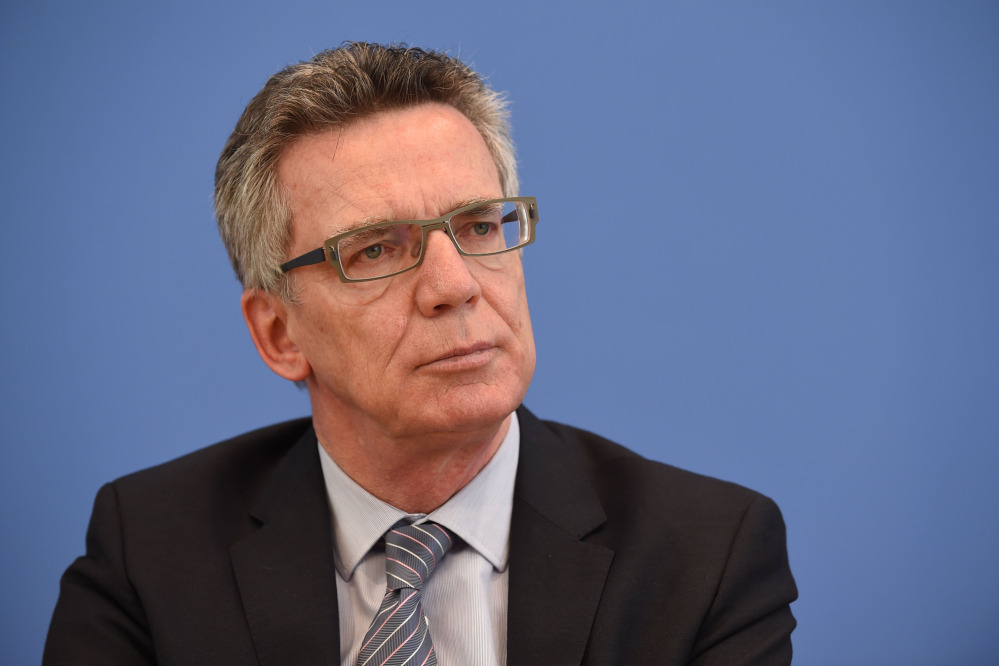 German Interior Minister Thomas de Maiziere, seen at a press conference in Berlin on June 18, is adding to pressure for an American response to a case in which a German intelligence employee is reported to have spied for the U.S.