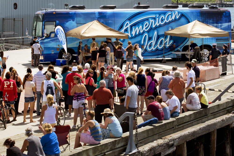 People wait in line on the Maine State Pier in Portland to try out for “American Idol.”