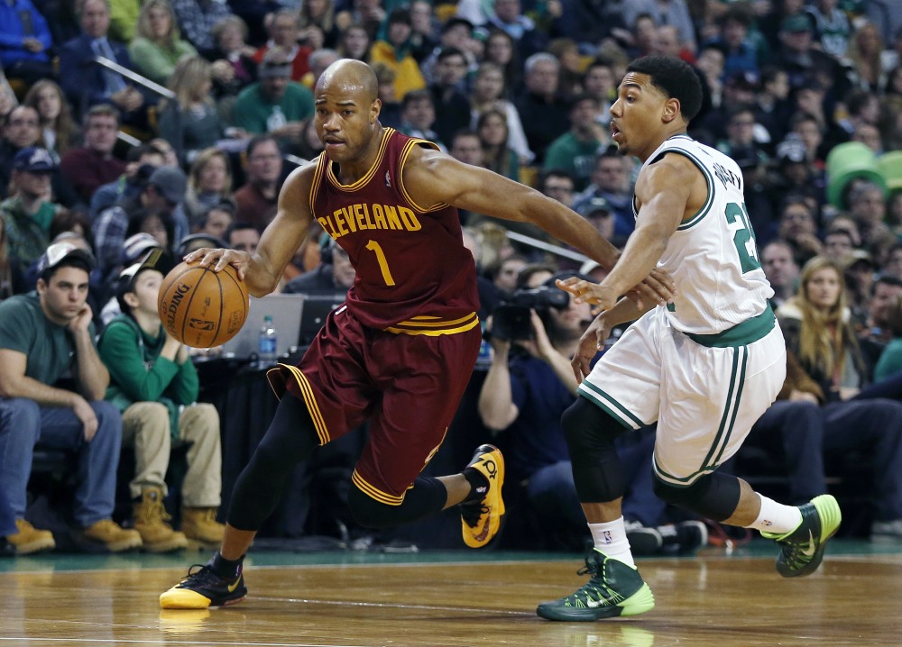 In this Dec. 28, 2013 file photo, Cleveland Cavaliers’ Jarrett Jack (1) drives past Boston Celtics’ Phil Pressey (26) in the second quarter of an NBA basketball game in Boston.