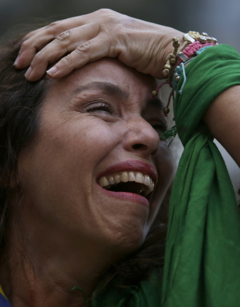A Brazil soccer fan cries as she watches Germany defeat her team in a World Cup semifinal match, via a live telecast in Belo Horizonte, Brazil, Tuesday.
