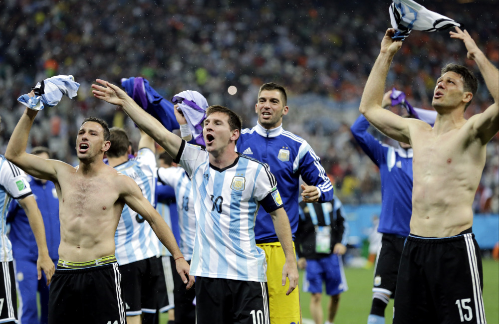 Argentina’s Lionel Messi (10) celebrates with this teammates after Argentina defeated the Netherlands 4-2 in a penalty shootout after extra time to advance to the finals during the World Cup semifinal soccer match in Sao Paulo Brazil on Wednesday.