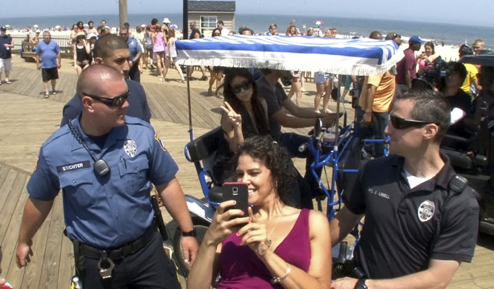 Sabryna Alvarez of Eatontown, N.J., grabs a selfie Tuesday with Kim Kardashian and her friend and publicist Jonathan Cheban on the boardwalk in Seaside Heights, N.J.
