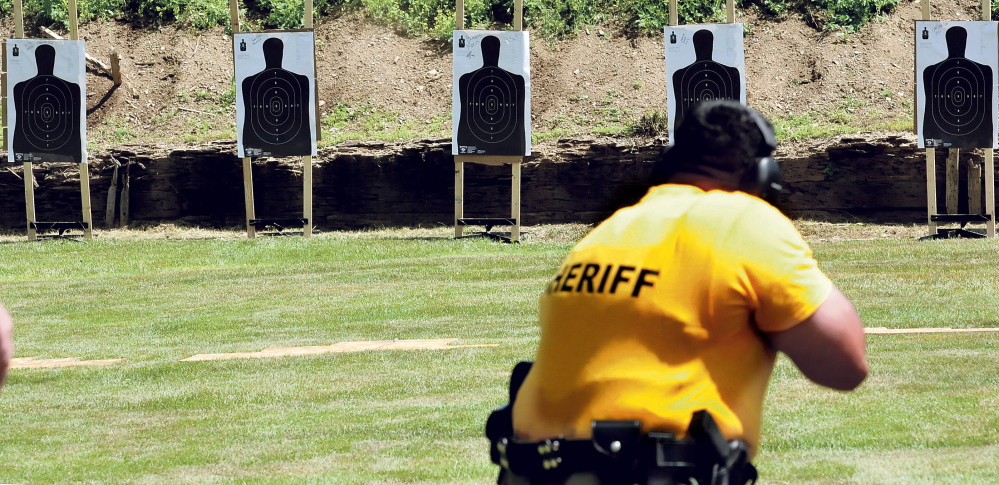 Chris Donahue, brother of the late Chief Deputy Shawn Donahue of the Washington County Sheriff’s Department, aims during a competition honoring his brother in Winslow on Wednesday.