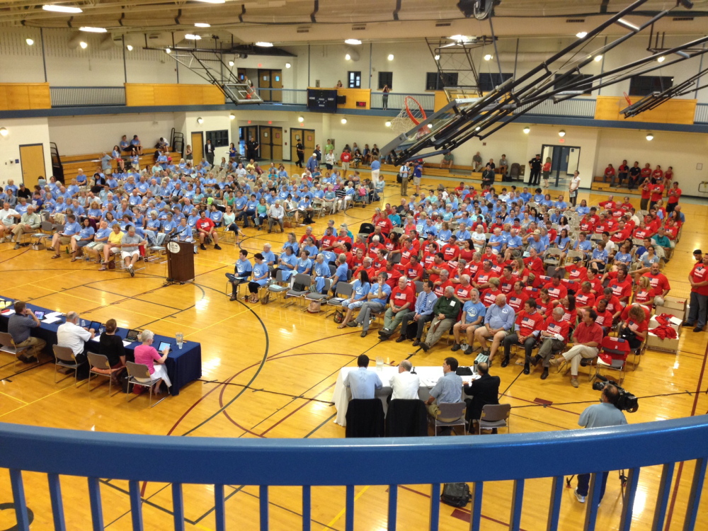 A large crowd, many wearing colored T-shirts, attends Wednesday's City Council meeting in the South Portland Community Center gym. 