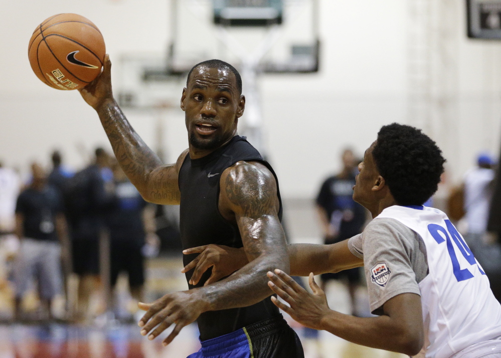 Lebron James plays basketball with high school students during the Lebron James Skills Academy on Wednesday in Las Vegas. He has yet to decide where he’ll play next year.