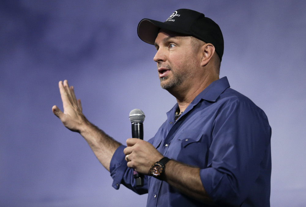 Country music star Garth Brooks speaks at a news conference on Thursday in Nashville. “If the prime minister himself wants to talk to me I will crawl, swim, I will fly over there this weekend, sit in front of him.” he says.
