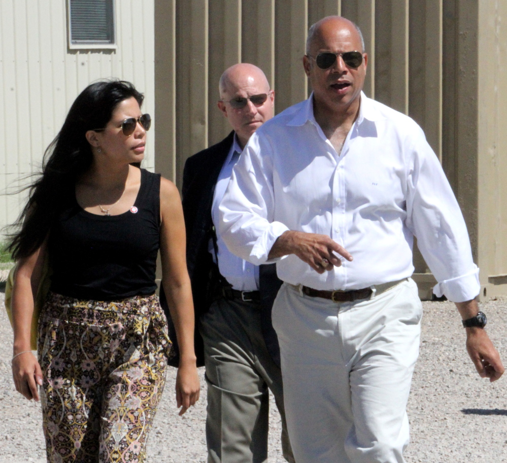 Department of Homeland Security director Jeh Johnson walks to a podium after finishing a tour of the Residential Detention Facility inside the Federal Law Enforcement Training Center in Artesia, N.M. on Friday, July 11, 2014. Johnson visited the facility housing 400 Central American women and children and warned immigrants that “we will send you back” if they try crossing into the country. (AP Photo/Pool, El Paso Times, Rudy Gutierrez)