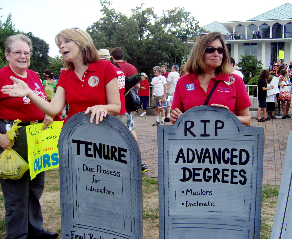 Demonstrators gather outside the North Carolina General Assembly in Raleigh last summer to protest the elimination of tenure and extra pay for teachers with advanced degrees in the state.